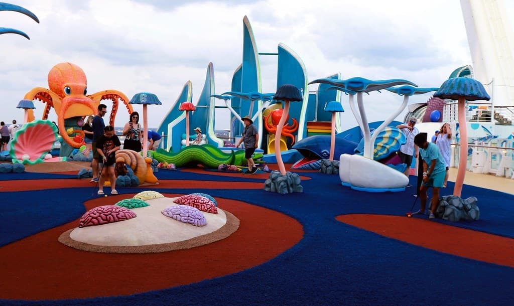 A colorful, whimsical miniature golf course with sculptural holes