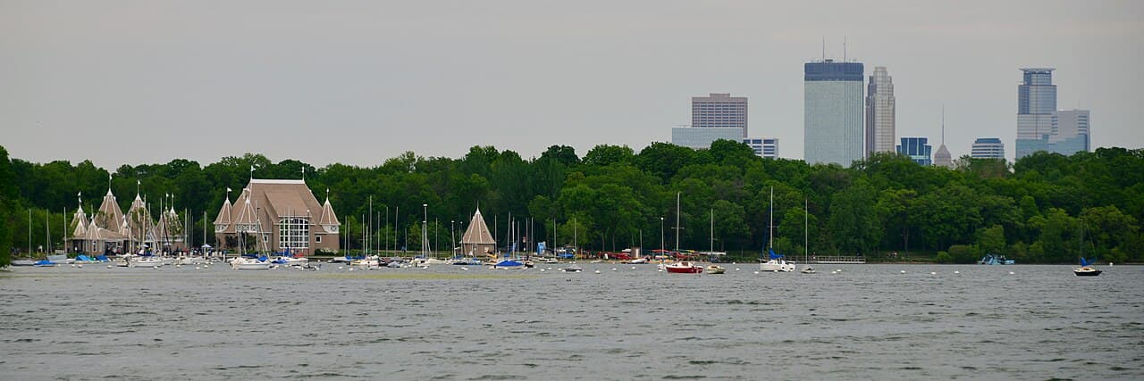 The Lake Harriet Bandshell with the lake and Minneapolis skyline